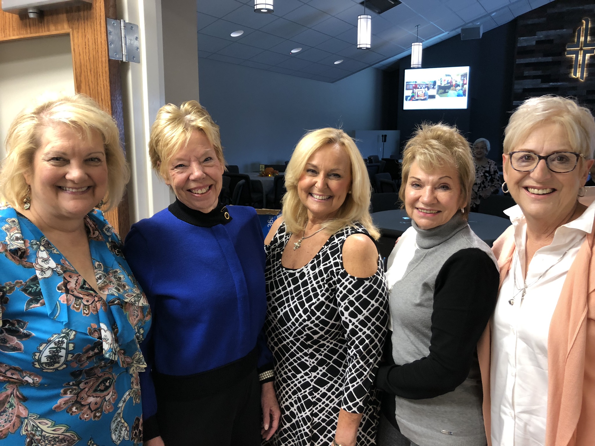 A group of women from Living Hope smiling together at church